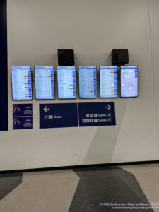 a group of screens on a wall