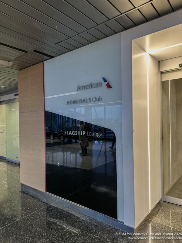 a glass wall with a sign on it