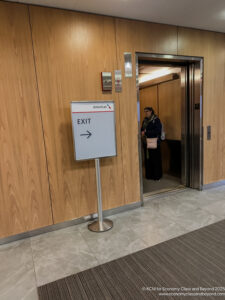 a woman standing in an elevator