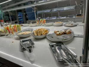 a table with plates of food and utensils