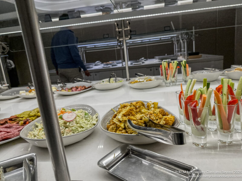 a buffet table with food in bowls