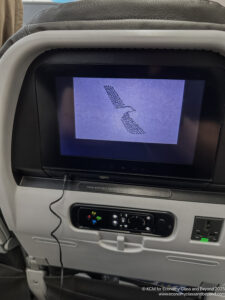 a screen on the seat of an airplane