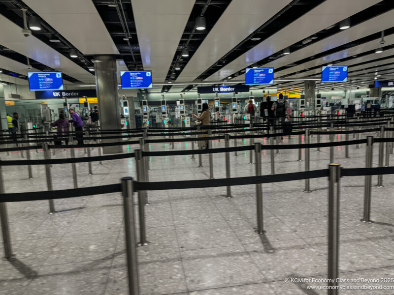 a group of people standing in a line in an airport