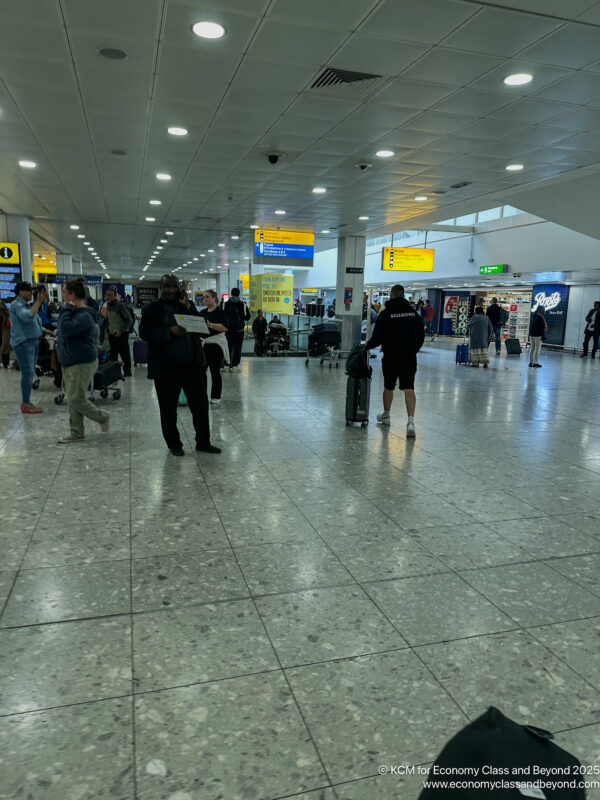 people in a large airport terminal