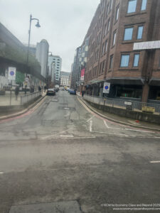 a street with cars and buildings