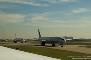 a group of airplanes on a runway
