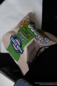 a bag of pretzels on a black surface