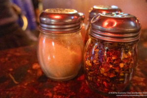 a group of jars with spices