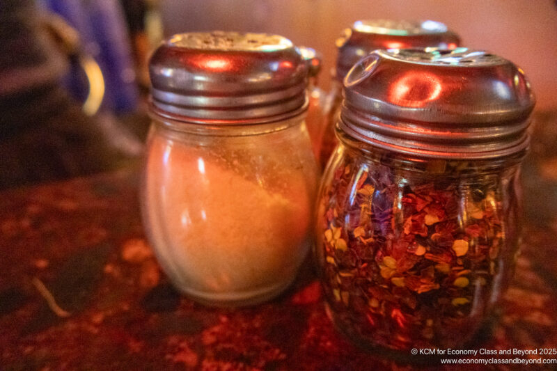 a group of jars with spices