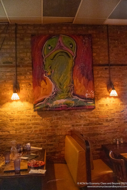 a painting on a brick wall