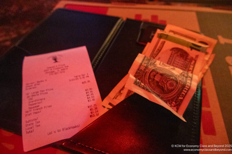 a bill and cash on a table