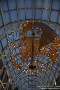 a globe shaped light fixture with lights