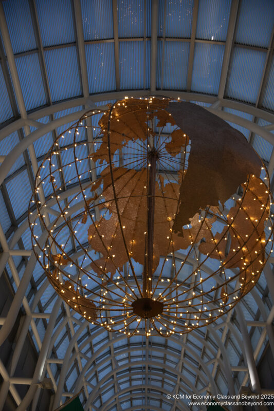 a globe shaped light fixture with lights