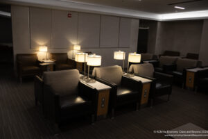 a group of chairs with lamps in a room