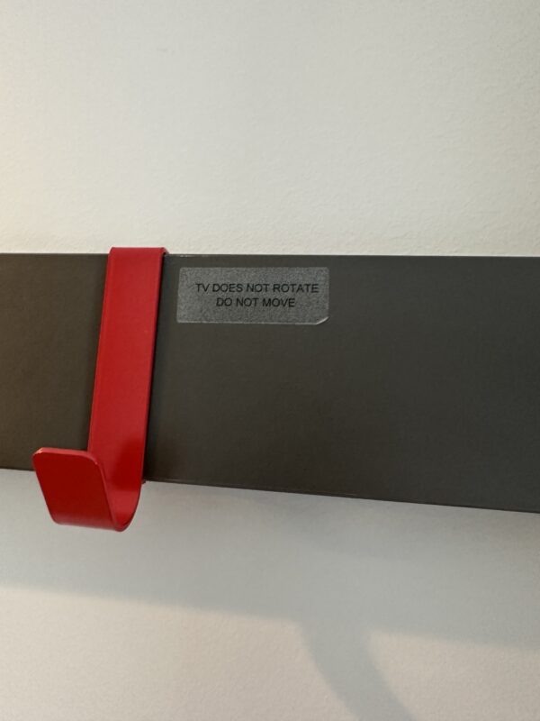 a black and red coat rack