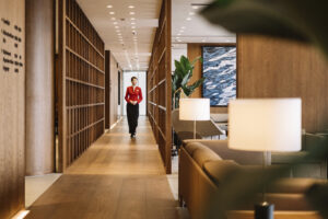 a woman walking in a hallway