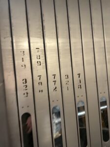 a row of metal dividers with numbers