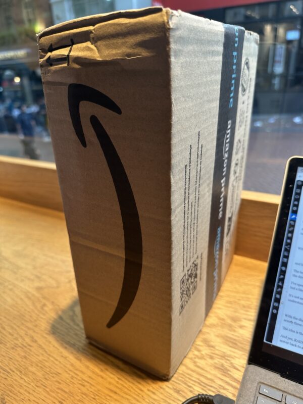 Amazon UK box on a workbench. 