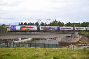 An Avanti West Coast train runs along west coast main railway line in Cumbria and crosses the bridge over the M6 Motorway at Clifton near Penrith. Work is taking place to replace the bridge with a new bridge set to be installed early in 2026: 20 August 2025 STUART WALKER/AVANTI WEST COAST