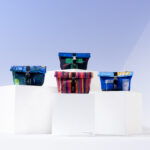 Pedestal image of the 4 new Club World amenity kits designed by the British artists made by the skincare brand anatomē.