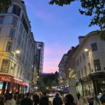 New Street at dusk with the party crowd out. Birmingham