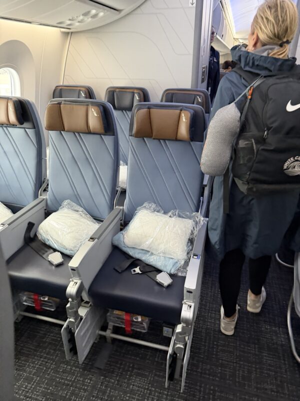 a person walking in an airplane