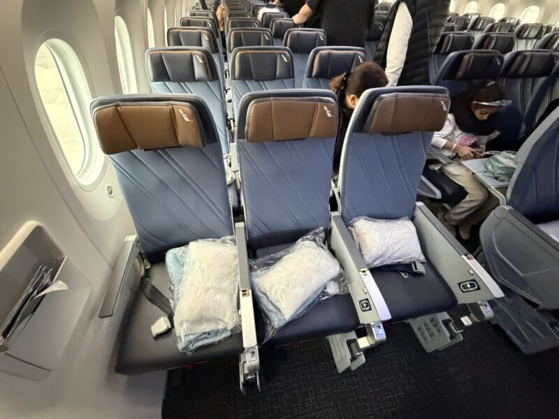 a group of people sitting in an airplane