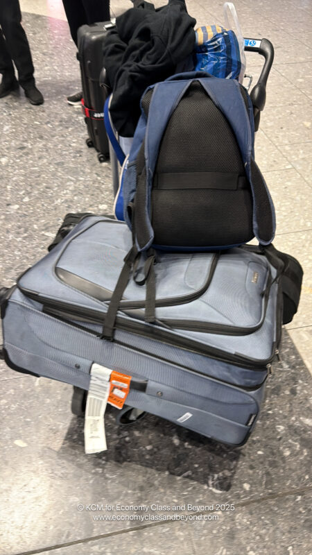 a backpack on top of luggage