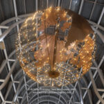 a large globe with lights from the ceiling