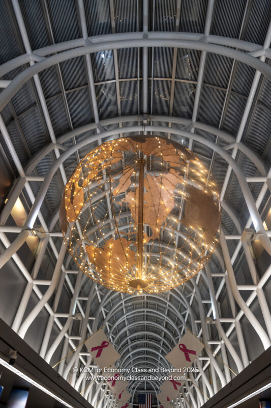a large globe shaped chandelier with lights