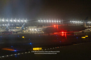 airplanes on a runway at night