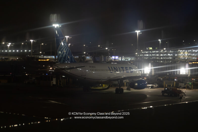 an airplane at an airport at night