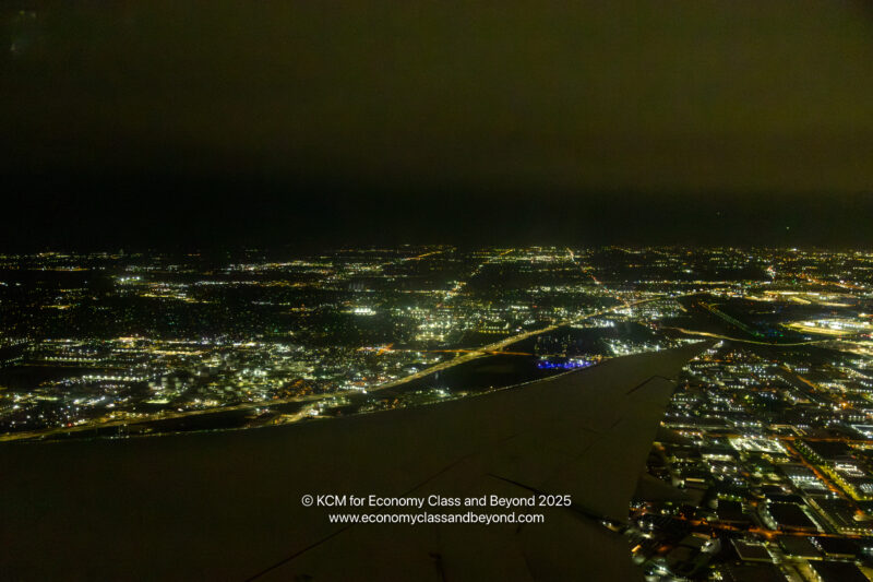 a view of a city at night from an airplane