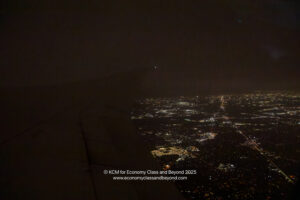a view of a city at night from an airplane