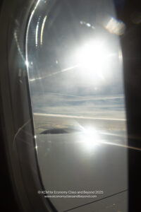 a sun shining through a window