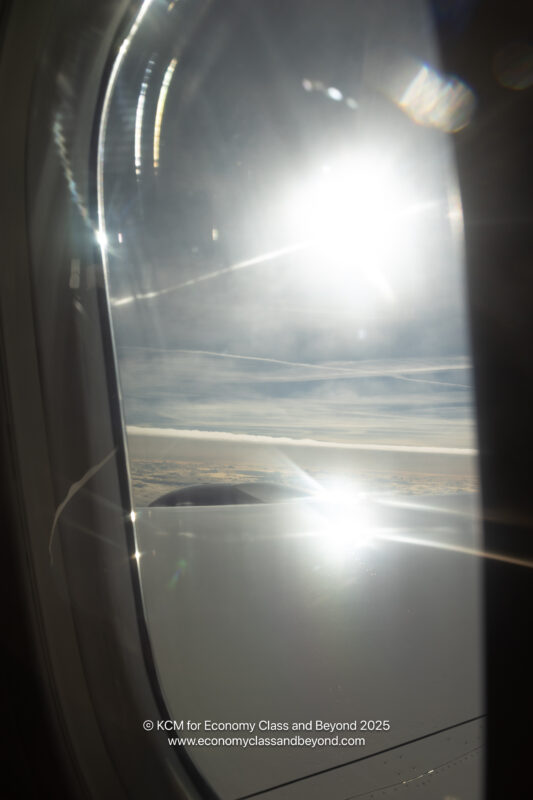 a sun shining through a window