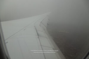 an airplane wing in the sky