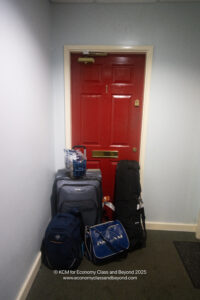 a red door with luggage on it