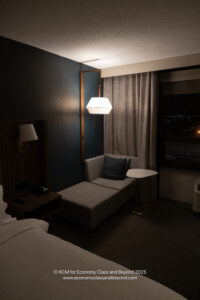 a room with a couch and a lamp