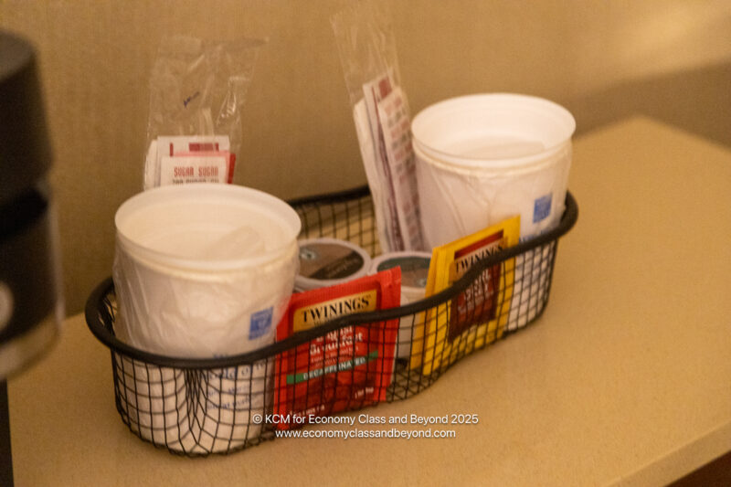 a basket with cups and packets