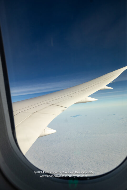 an airplane wing in the sky