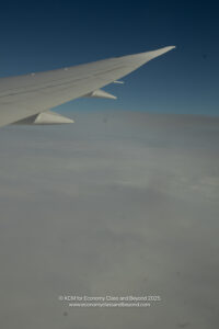 an airplane wing in the sky