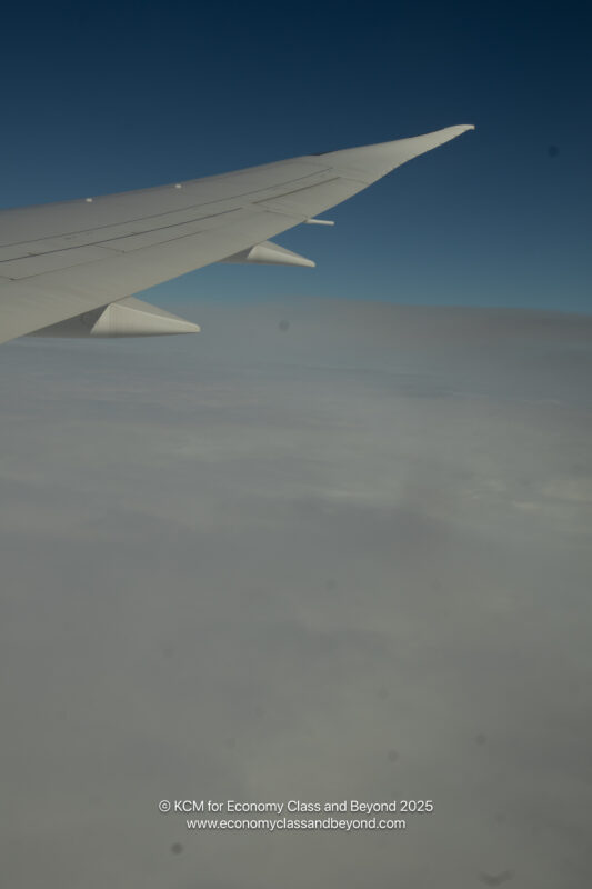 an airplane wing in the sky