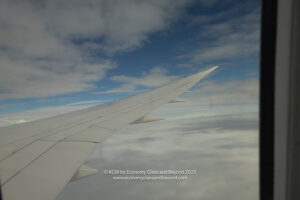 an airplane wing in the sky