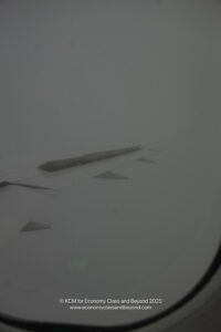 a plane wing in the sky