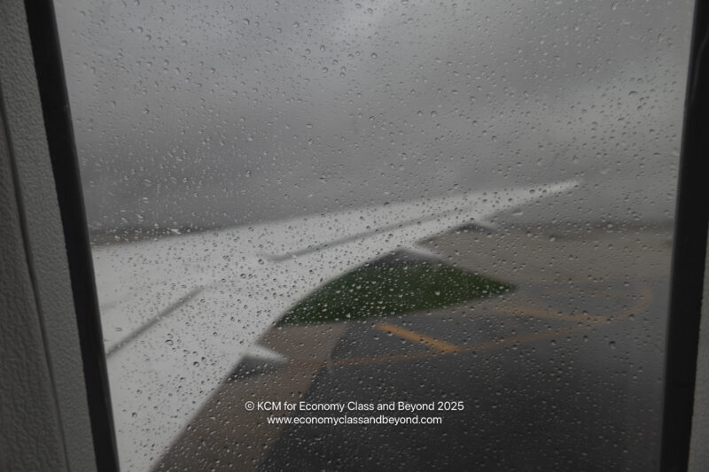 a raindrops on the wing of an airplane