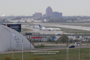 an airport with airplanes on the runway