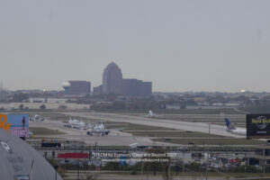 a group of airplanes on a runway