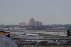 an airport with airplanes on the runway