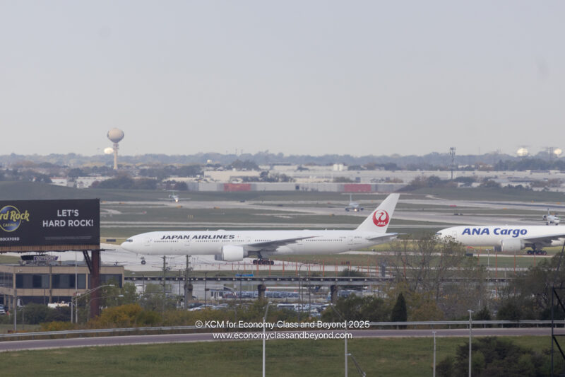 a large white airplane on a runway